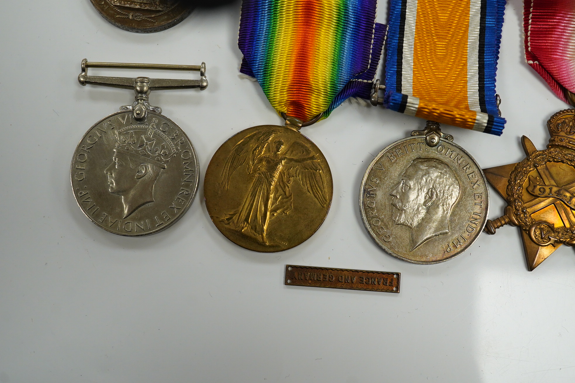 A WWI and WWII medal group awarded to R. Whitham A.B. R.N.; a First World War medal trio with a George V Long Service and Good Conduct Medal, together with a 1939-1945 Medal, the Atlantic Star, and the 1939-1945 Star. Co